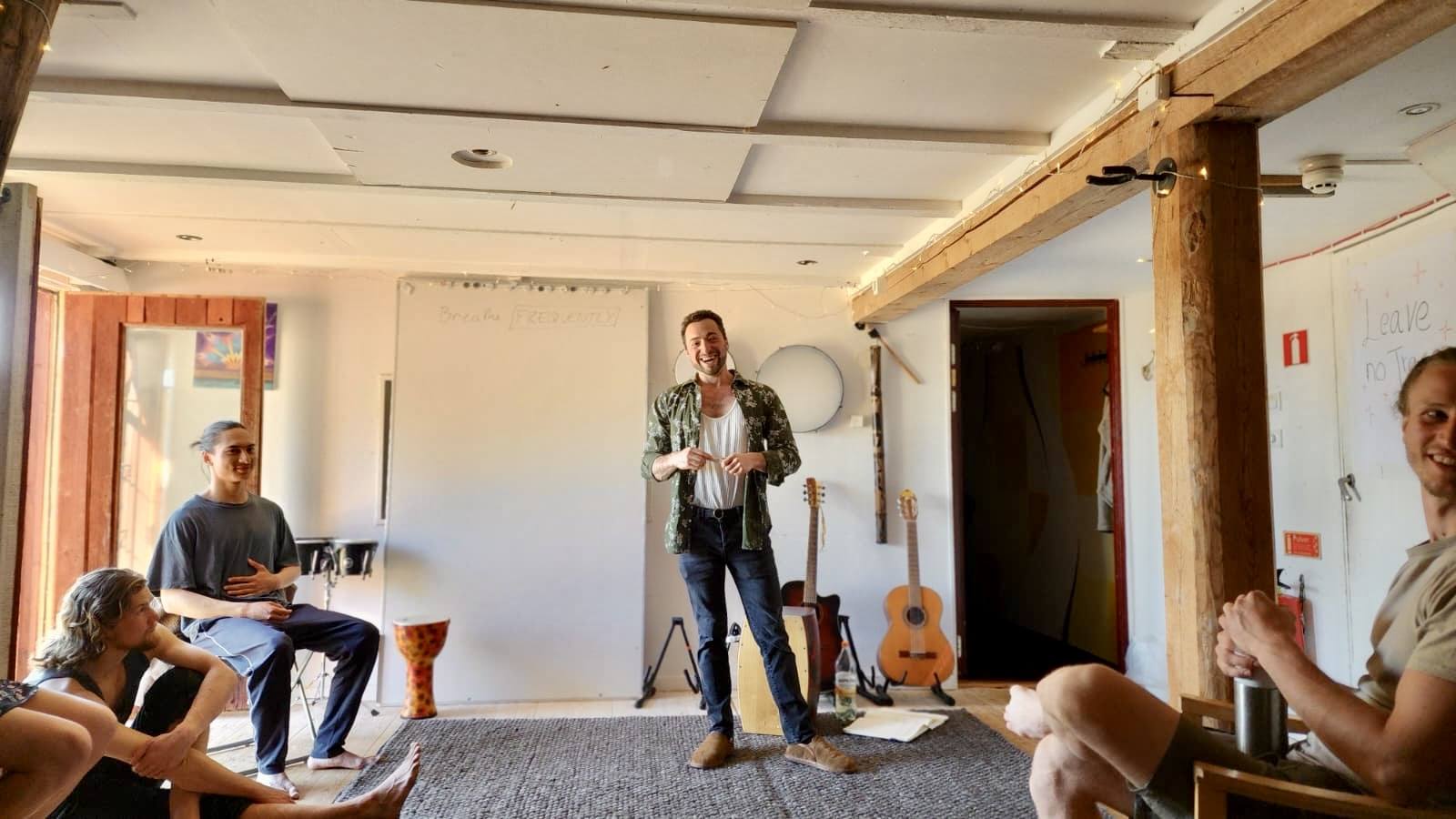 Daniel teaching a workshop, with 'Breathe FREQUENTLY' written on the whiteboard behind him